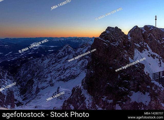 Morning mood on Zugspitze, sunrise on Germany's highest mountain Top of Germany. Landscape photography with Zugspitze cross (4.88 m)