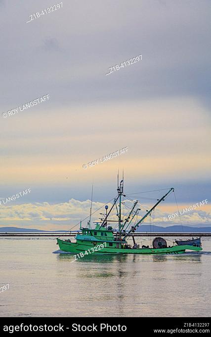 Colourful commercial fishing boat returning to Steveston in British Columbia Canada