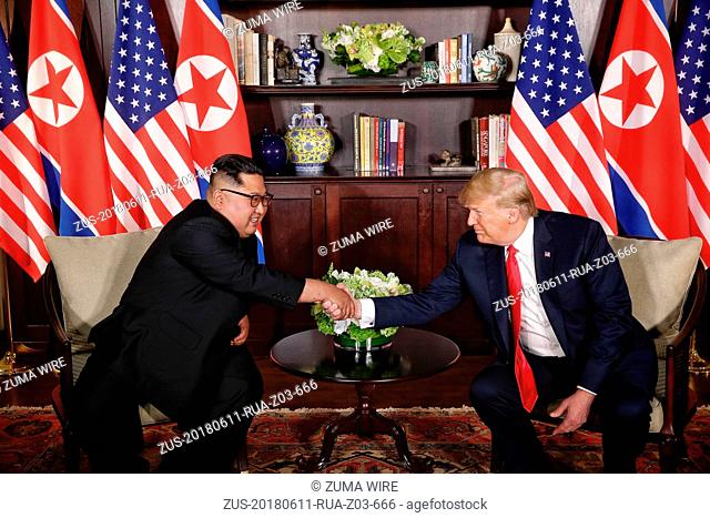 Jun 11, 2018 - Singapore - Top leader of the Democratic People's Republic of Korea (DPRK) KIM JONG UN (L) shakes hands with U.S
