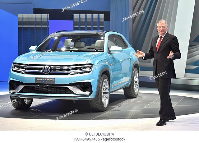 Heinz-Jakob Neusser, chief of development for Volkswagen, presents the VW Cross Coupe GTE during the media preview of the North American International Auto Show...