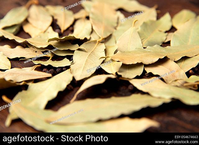 Bay laurel leaves on a wooden board. Spices