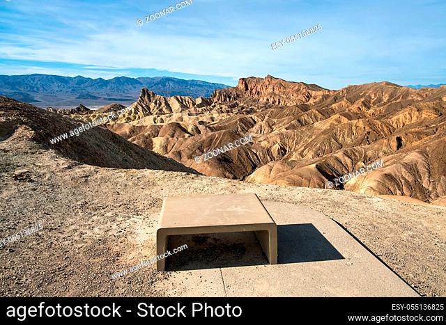 Concrete plate on the ground on the background of the rocky mountains and cloudy sky in Red Rock Canyon in the USA. Horizontal