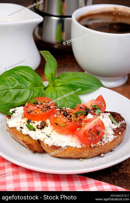 Bruschetta with ricotta and cherry tomatoes seasoned  spices, basil