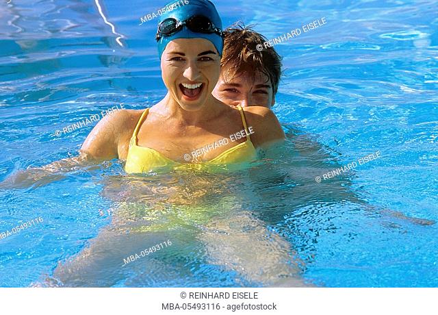 young couple in the swimming-pool