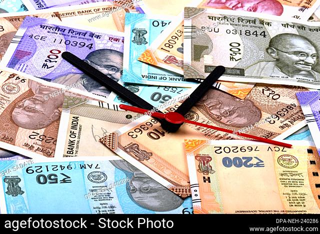 Time is Money, Time and money concept, Indian Currency, Rupee, Indian Rupee, Indian Money, Business, finance, investment, saving and corruption concept - Image