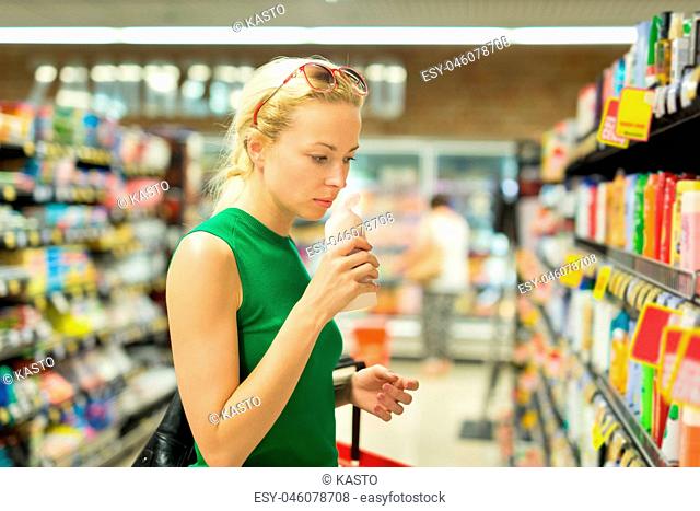 Woman shopping personal hygiene products at supermarket