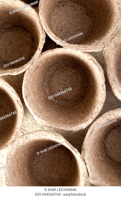 brown soft pots of paper and peat for planting seedlings, closeup, top