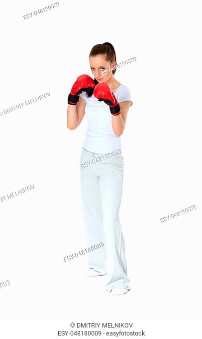 Sporty young woman in red fighting gloves on a white background