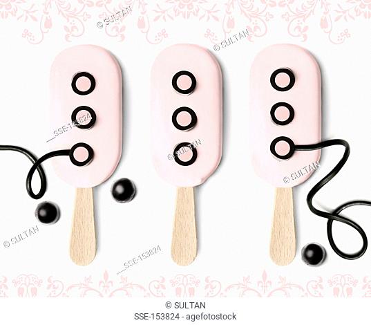Funny pink ice cream lollipops
