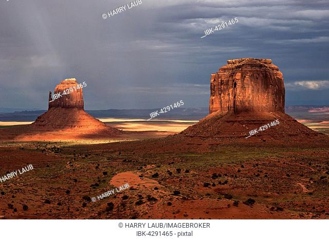 Rock formations, East Mitten Butte and Merrick Butte, after storm, clouds, evening light, Monument Valley Navajo Tribal Park, Arizona, USA