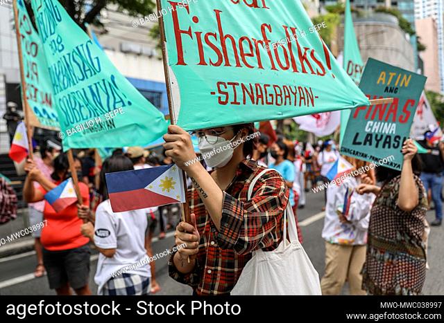 Metro Manila, Philippines. 12th June 2021. Activists shout slogans during a protest in front of the Chinese consulate marking Independence Day in the financial...