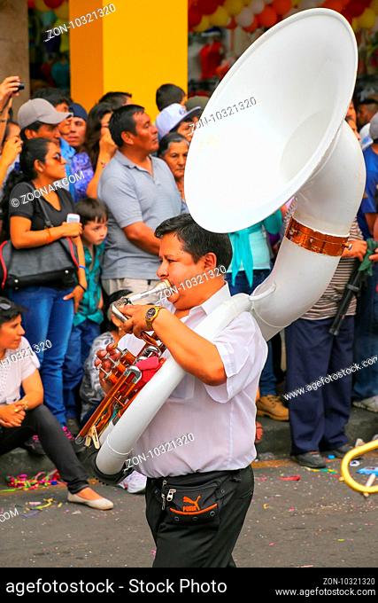 Local man playing sousaphone during Festival of the Virgin de la Candelaria in Lima, Peru. The core of the festival is dancing and music performed by different...