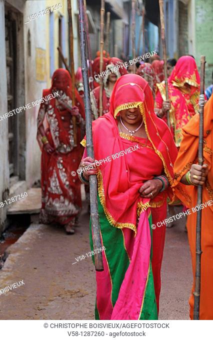 India, Uttar Pradesh, Holi festival, Colour and spring festival celebrating the love between Krishna and Radha  Celebration of Lathmar Holi : On this particular...