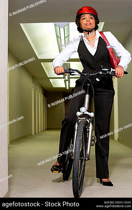 Female office worker on a mountain bike