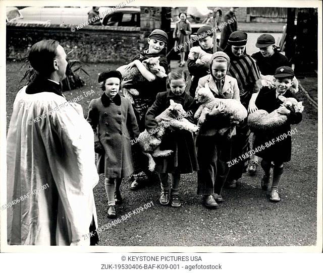 Apr. 06, 1953 - Lambs go to Church : The Rev. John Hughes smiles a welcome from the church door, as children arrive with six lambs - in -arms
