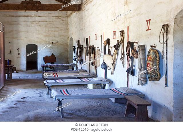 Bunkhouse or sleeping room with cots and riding tack and personal belongings of Spanish at Mission La Purisima State Historic Park, Lompoc, California