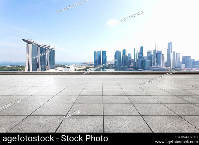 cityscape of singapore from empty brick floor