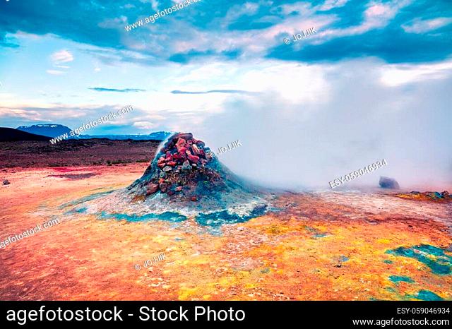 Steaming fumarole in geothermal valley Hverarond. Exotic summer landscape of volcanic Icelandic landmark, Reykjahlid village location, north Iceland, Europe