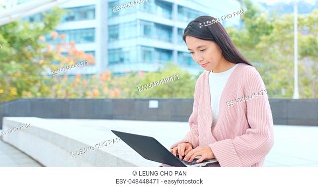 Woman using notebook computer