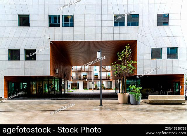 Oslo, Norway - August 11, 2019: Modern building with ventilated facade in natural stone in Barcode Project area