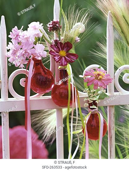 Floral decoration with cereal ears on garden fence