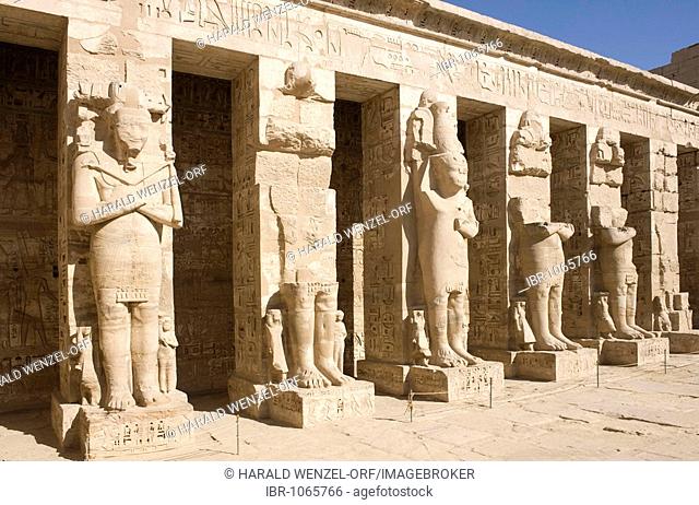 Mortuary Temple of Ramesses III, Ramesseum in Medinet Habu, courtyard with colonnade and statues, West Thebes, Luxor, Egypt, Africa