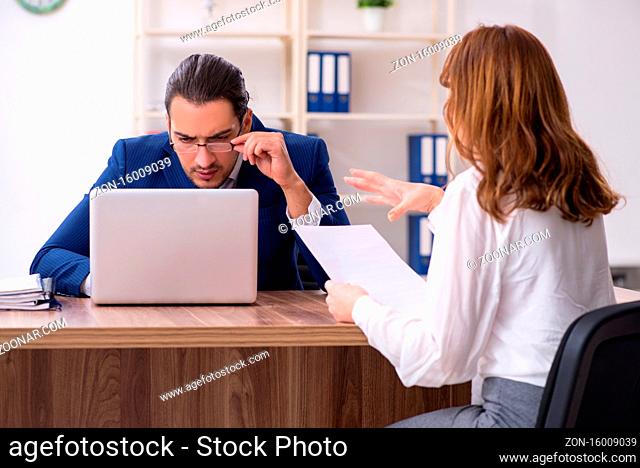 Business meeting between businessman and the businesswoman