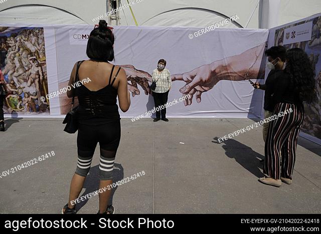 MEXICO CITY, MEXICO - APR 21, 2022: A Visitor takes a photo during a tour of the exhibition at the opening of the replica of Michelangelo's Sistine Chapel in...