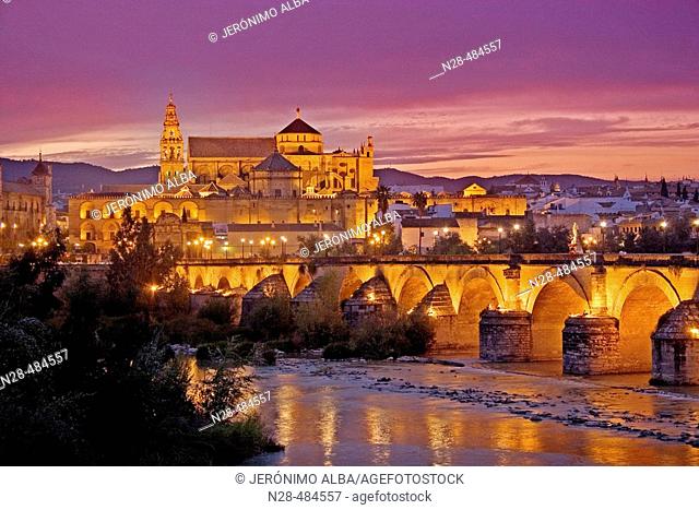 Guadalquivir river, Roman bridge and mosque-cathedral in the evening. Córdoba. Andalucia. Spain
