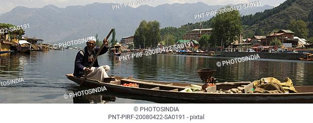 Man selling vegetable in a boat, Dal Lake, Srinagar, Jammu and Kashmir, India