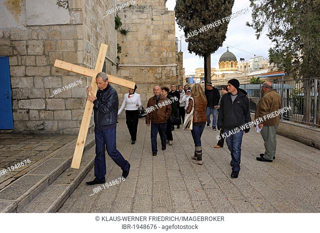 Russian pilgrims with cross on the Via Dolorosa, Arab Quarter in the old town of Jerusalem, Israel, Middle East