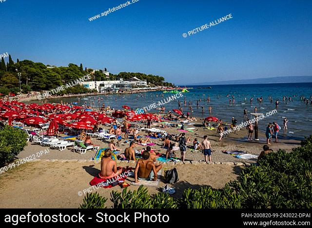 FILED - 27 August 2017, Croatia, Split: Bathers sunbathe on the beach Bacvice. Due to the increased number of new corona infections