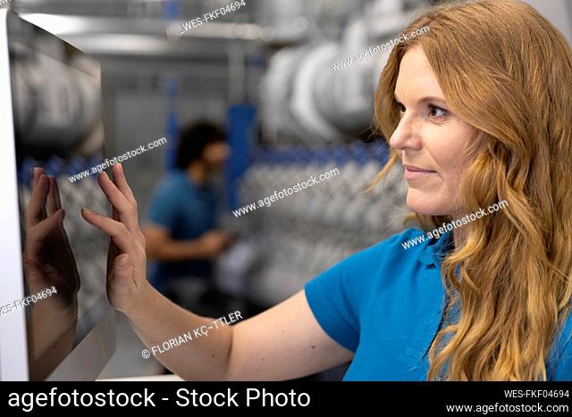 IT support using touch screen device in factory