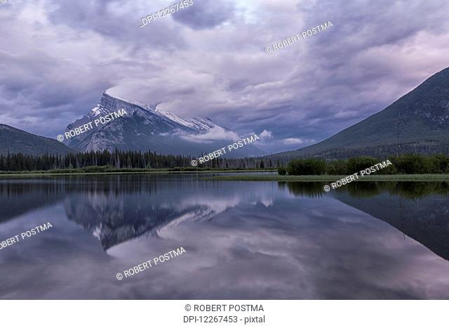 Storm clouds over Mount Rundle and the Vermillion Lakes, Banff National Park; Alberta, Canada