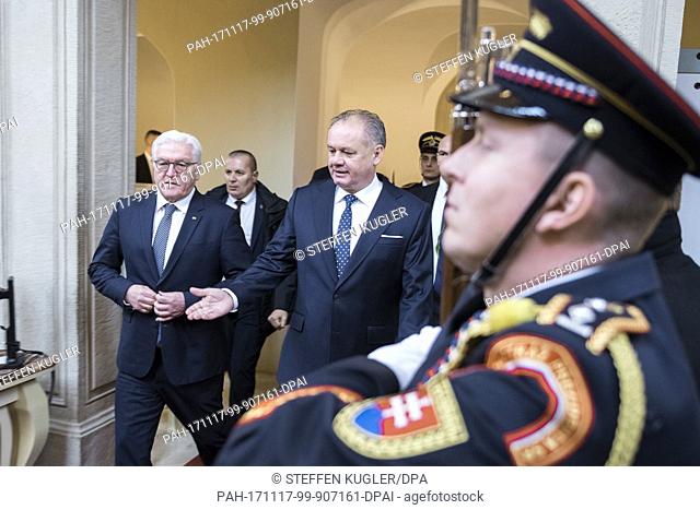 HANDOUT - Handout picture made available on 17 November 2017 showing German President Frank-Walter Steinmeier (L) being received with military honours by Andrej...