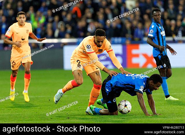 Atletico's Matheus Cunha and Club's Raphael Onyedika fight for the ball during a soccer game between Belgian Club Brugge KV and Spanish Atletico de Madrid