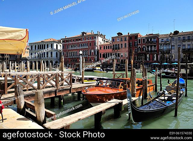 People sitting in front of the Venetian Rialto Bridge, Venice