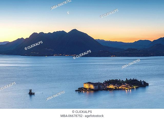 Borromean Islands, Stresa, Lake Maggiore, Verbano-Cusio-Ossola, Piedmont, Italy. Isola Bella at dawn with moon