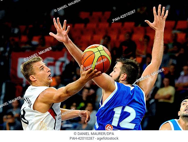 Germany's Heiko Schaffartzik (L) vies for the ball with Greece's Ian Vougioukas during the Basketball Supercup match between Germany and Greece at ratiopharm...