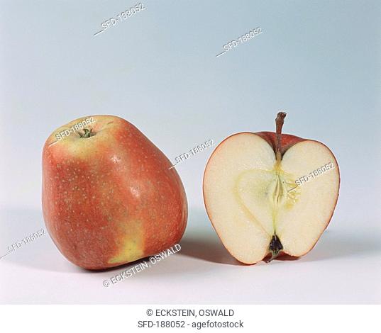 One half and one whole Gala apple