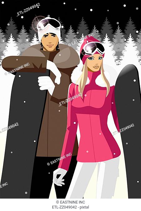 Couple holding snowboards