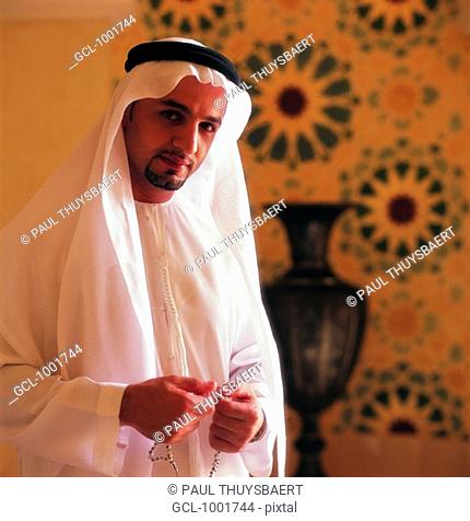Arab man with mosbah in his hands
