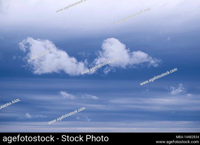 Cloud atmosphere, light clouds in front of dark cloud layers