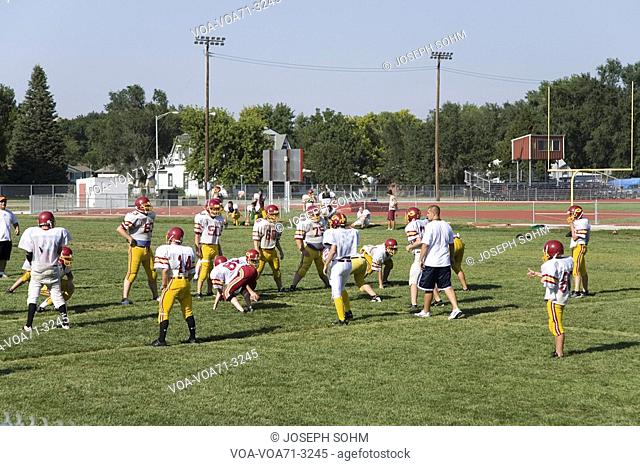 High school football team practicing in 110 degree heat at Gothenburg, Nebraska, along old Lincoln Highway, US 30