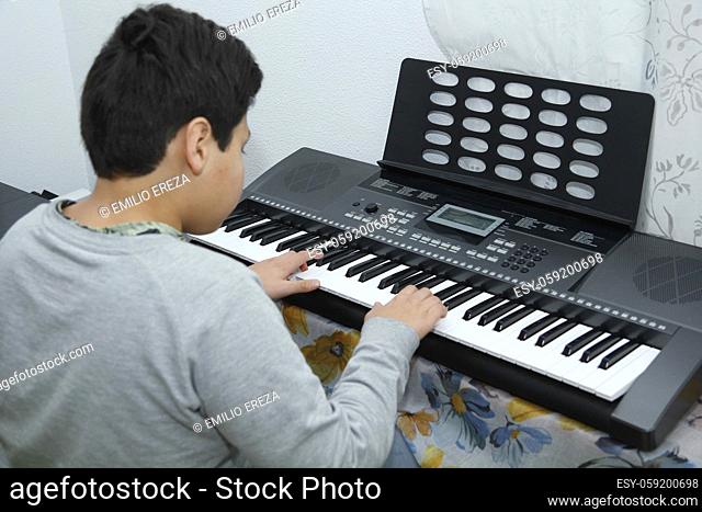 Boy playing a smart piano