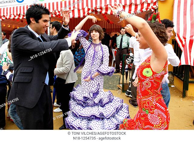 Abril, 20, 2010 Spain Seville April Fair. A crowd of people attend today the first real day of the 'feria de Abril' of Seville Many women dresses with the...