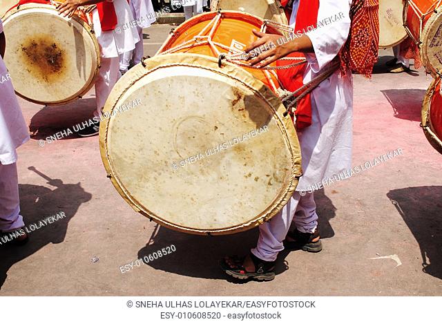 Playing musical instrument called 'dhol-taash' during Anant Chaturdashi Ganpati, Visarjan Miravnuk, Pune , Maharashtra , India
