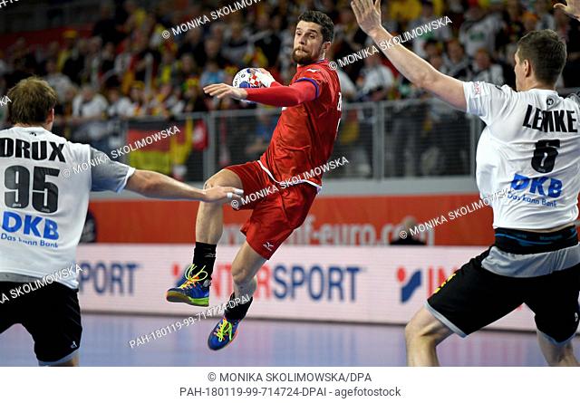 Germany's Paul Drux (L) and Finn Lemke in action against Czech Republic's Ondrej Zdrahala during the European Handball Championship match between Germany and...