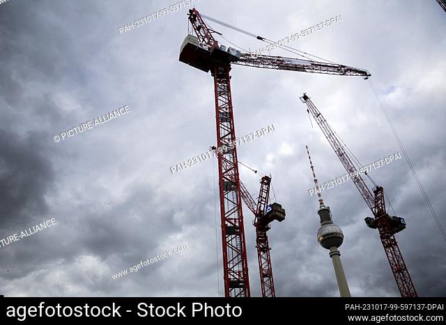PRODUCTION - 17 October 2023, Berlin: Construction cranes of the Covivio high-rise building site tower up in front of the Berlin TV tower