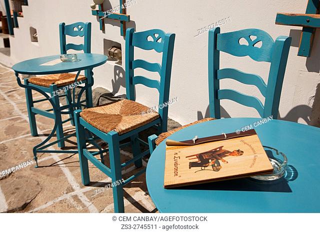 Tables and chairs of an open-air cafe in the old town Chora-Chorio, Kimolos, Cyclades Islands, Greek Islands, Greece, Europe